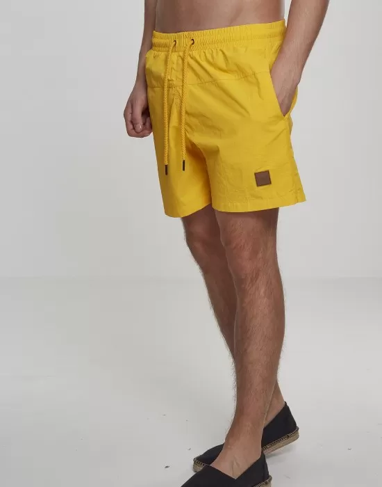 Мъжки плувни шорти Urban Classics Block в жълт цвят, Къси панталони - Hoodstyle.bg