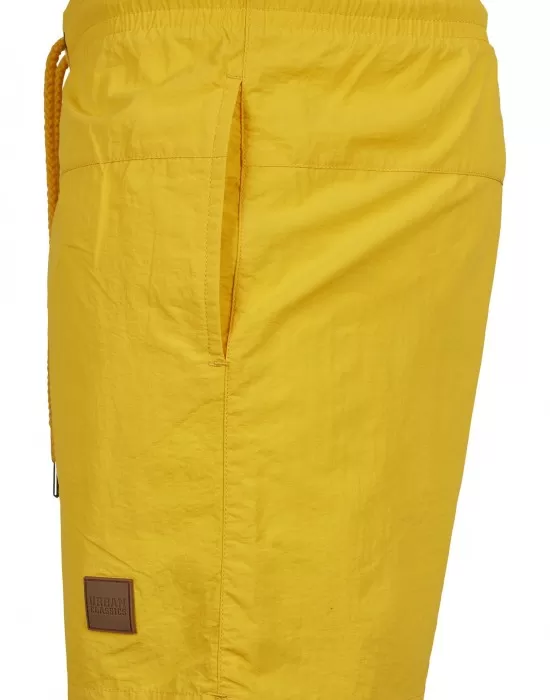 Мъжки плувни шорти Urban Classics Block в жълт цвят, Къси панталони - Hoodstyle.bg